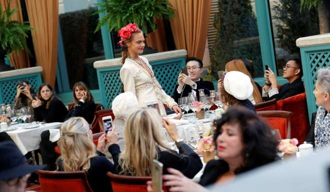 Cara Delevingne models a Chanel look at the Ritz. Photo: Reuters