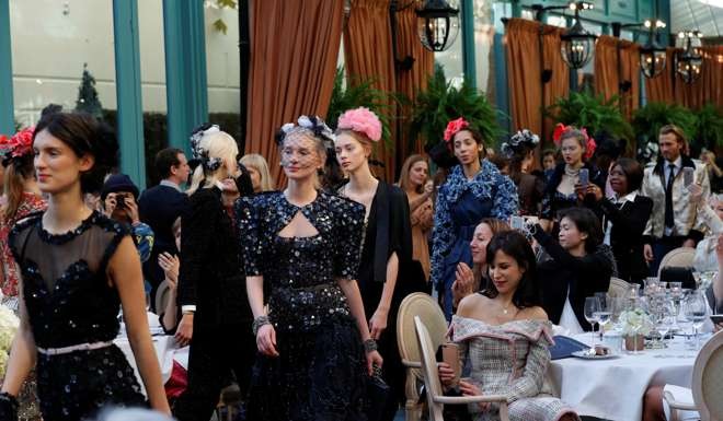 The fashion on show evoked the Cafe Society evening dresses once worn at the Ritz. Photo: Reuters