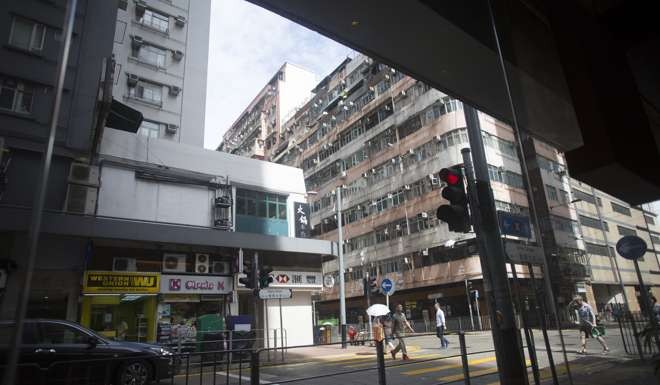 Land for housing development in high-density areas such as Kennedy Town requires old buildings to be demolished to make way for new ones. Photo: Chen Xiaomei