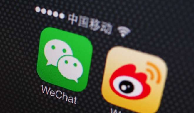 A picture illustration shows the icons of WeChat and Weibo app in Beijing. Photo: Reuters