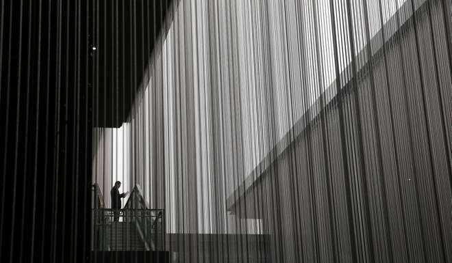 A man looks at a phone during the World Internet Conference in Wuzhen, Zhejiang, last month. Tighter regulations will make mobile games appealing to firms looking to place mobile advertisements, which means better monetisation for indie firms and the titans alike. Photo: Reuters