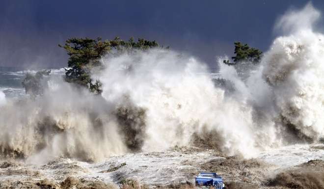 Tsunami waves hit the coast of Minamisoma in Fukushima prefecture. The disaster led to the meltdown of three nuclear reactors in the prefecture and the release of radioactive material. Photo: AFP