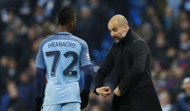 Manchester City manager Pep Guardiola speaks to Kelechi Iheanacho. Photo: Reuters