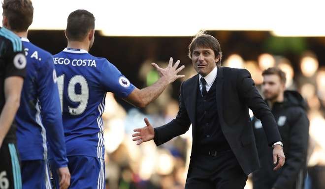 Chelsea manager Antonio Conte celebrates after the game with Diego Costa. Photo: Reuters