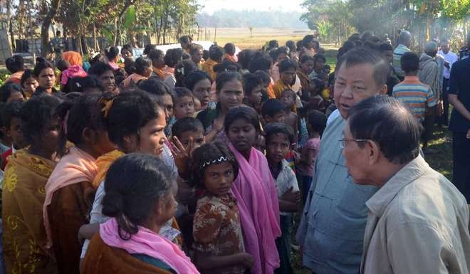 Rakhine State Investigation Commission officials meeting residents of Gwazon. Photo: AFP