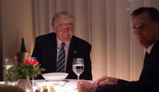 US president-elect Donald Trump dines with Mitt Romney. Photo: AFP