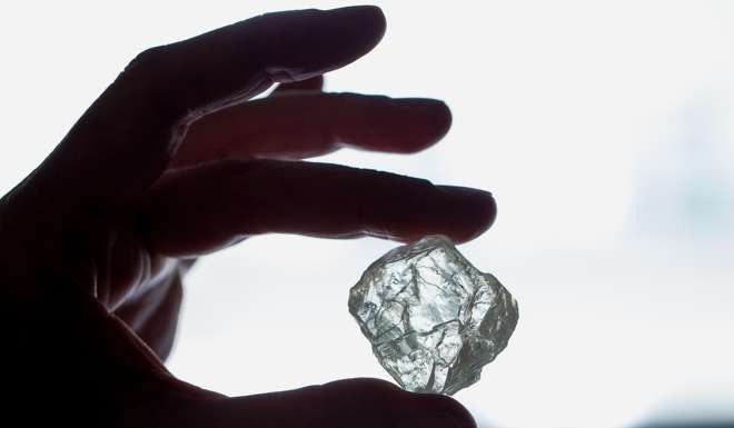 The Foxfire diamond is displayed for a photograph during a viewing in New York. The rare Foxfire was buried in a place where big gem-quality diamonds aren't supposed to exist. Photo: Bloomberg