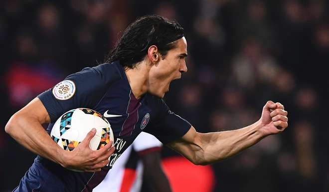 Paris Saint-Germain's Edinson Cavani celebrates after scoring against Nice. Photo: AFP