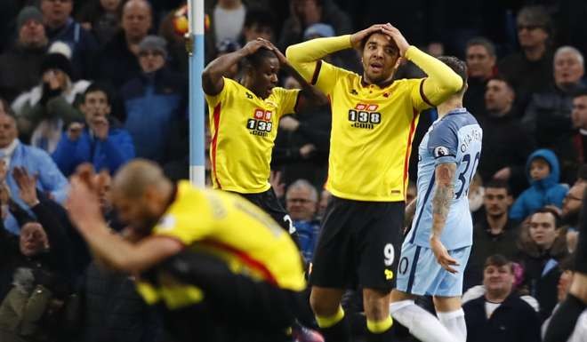 Watford's Odion Ighalo and Troy Deeney look dejected Action Images via Reuters / Jason Cairnduff