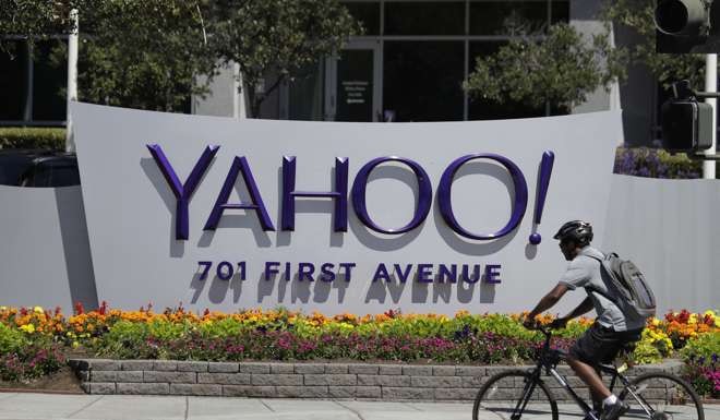 A cyclist rides past a Yahoo sign at the company's headquarters in Sunnyvale, California. Photo: AP