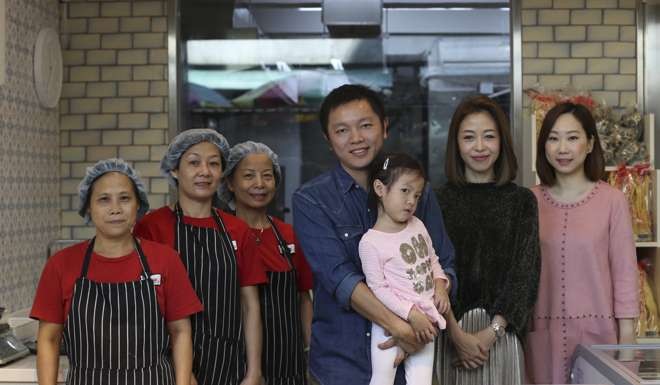 Hui, Tang, daughter Leyan and staff.
