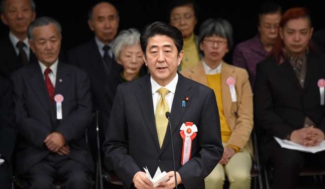 Japanese Prime Minister Shinzo Abe delivers a speech calling for the return of the Russia-controlled Southern Kurils, which Japan claims as the Northern Territories, in Tokyo in 2015. Photo: AFP