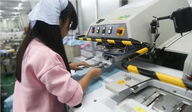 The Esquel automatic sleeve plackets sewing machine, developed in-house, enables one worker to operate two machines, resulting in a 100 per cent productivity gain. Photo: Handout