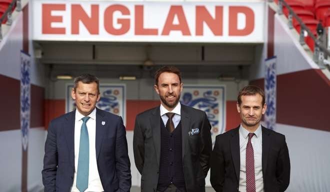 FA chief executive Martin Glenn), England's new manager Gareth Southgate and FA technical director Dan Ashworth at Southgate’s appointment as full-time England coach on December 1. Photo AFP