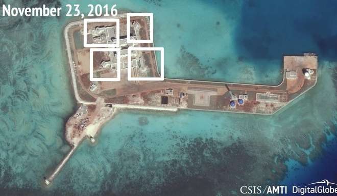 A satellite image shows what CSIS Asia Maritime Transparency Initiative says appears to be anti-aircraft guns and what are likely to be close-in weapons systems (CIWS) on the artificial island Hughes Reef in the South China Sea. Photo: Reuters