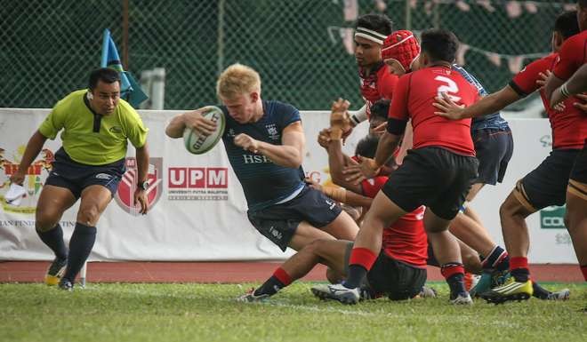 Gregor Ramage hunts for the try line for Hong Kong.