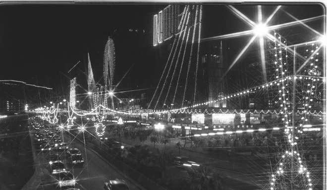 Christmas lights glow along Victoria Harbour, Tsim Sha Tsui East, in 1984.