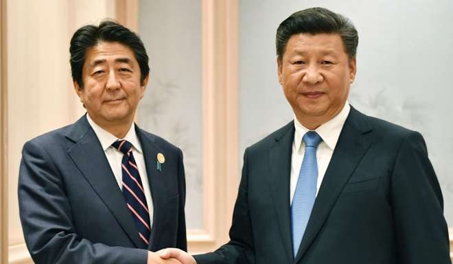 Prime Minister Shinzo Abe shakes hands with President Xi Jinping before a meeting on the sidelines of the G20 summit in Hangzhou, on September 5. Japan’s role, as the first nuclear victim, should be to lead in finding new peaceful ways to settle disputes and make friends with neighbours. Photo: AP