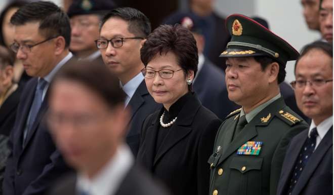 Chief Secretary Carrie Lam attends a ceremony commemorating the Nanking massacre. Photo: EPA