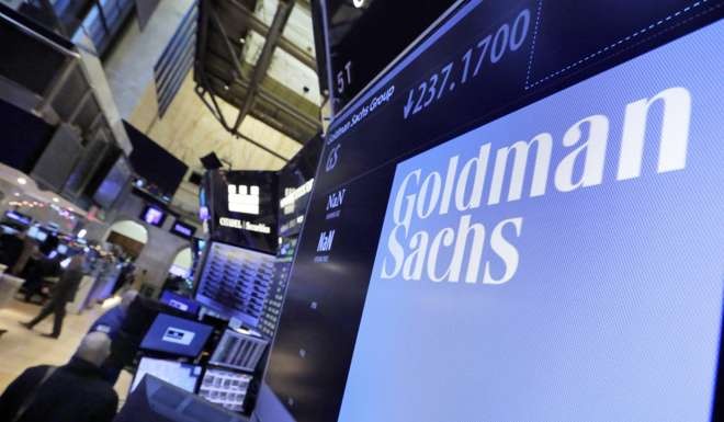 The logo for Goldman Sachs appears above a trading post on the floor of the New York Stock Exchange. Photo: AP
