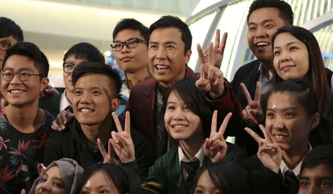 Donnie Yen poses with fans. Photos: Jonathan Wong