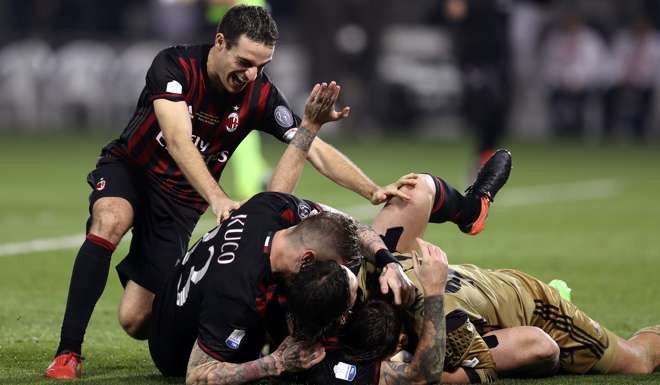 AC Milan's player celebrate after beating Juventus. Photo: Reuters