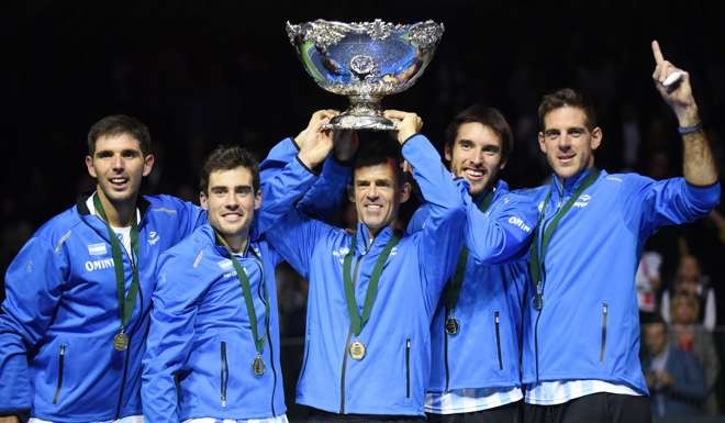 Juan martin del Potro (right) celebrates with the trophy after winning the Davis Cup World Group final against Croatia. Photo: AFP