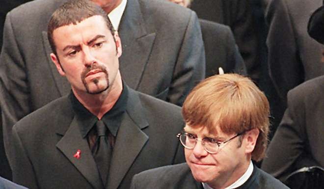 Pop stars George Michael (left) and Elton John leave Westminster Abbey following the funeral service of Diana, Princess of Wales, in 1997. Photo: AFP