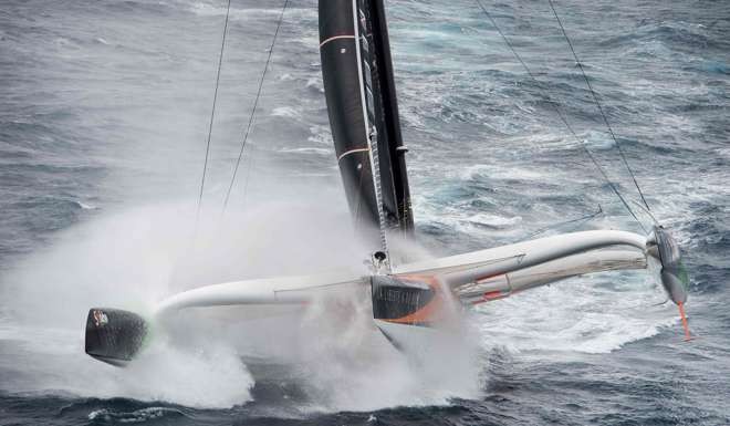 Thomas Coville navigating aboard his multihull boat. Photo: AFP