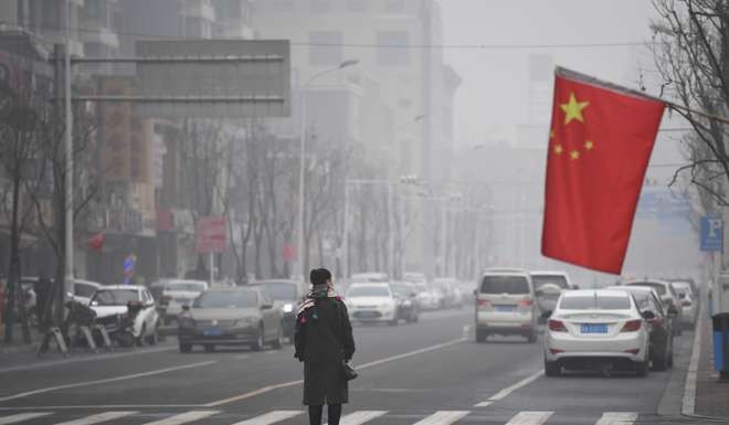 Shijiazhuang, in Hebei province, closed schools on December 21, as the country suffered through its sixth day under an oppressive haze. Photo: AFP