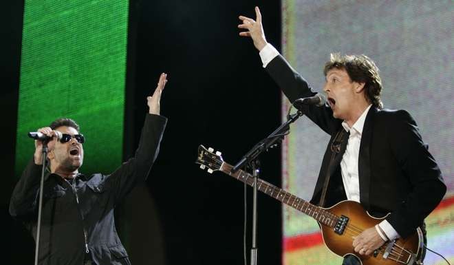 George Michael, left, and Paul McCartney perform during the Live 8 concert in Hyde Park, London, in 2005. Photo: AP