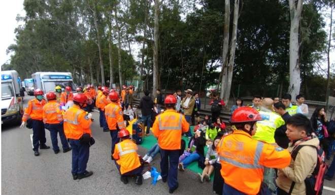 Emergency workers attend the scene of a major traffic accident on the San Tin Highway. Photo: SCMP Pictures