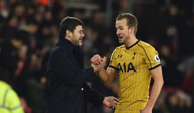 Mauricio Pochettino and Harry Kane as the striker leaves the field after being substituted. Photo: AFP