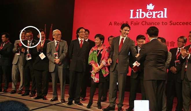 Michael Ching Mo Yeung (circled) looks on as Justin Trudeau is introduced by Raymond Chan (back to camera) at a 1,300-seat Liberal fundraiser in Toronto on June 15,2014.The event was co-organised by the Tru-Youths group that was based in Ching's office. Photo: Facebook