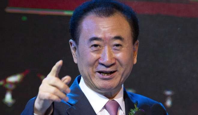 Wanda Group chairman Wang Jianlin is creating a global entertainment axis, with football at its heart. Photo: AP