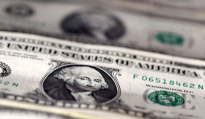 U.S. dollar notes are seen in this picture illustration as the currency rallied hard late in the year. Photo: Reuters