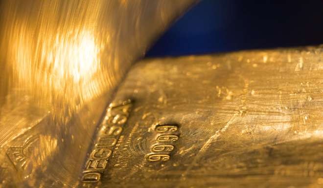 A Degussa stamp sits on a gold ingot on display inside the Deutsche Bundesbank's money museum in Frankfurt, Germany. Photo: Bloomberg