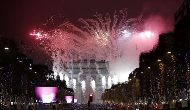 Fireworks illuminate the night sky over Paris. Photo: EPA
