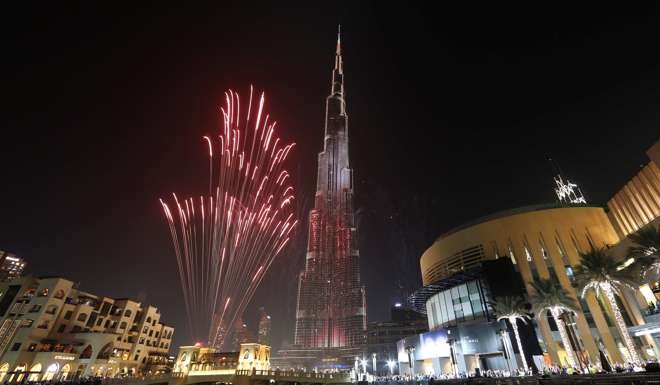 Fireworks explode around at the world's tallest building, Burj Khalifa, in Dubai. Photo: Reuters