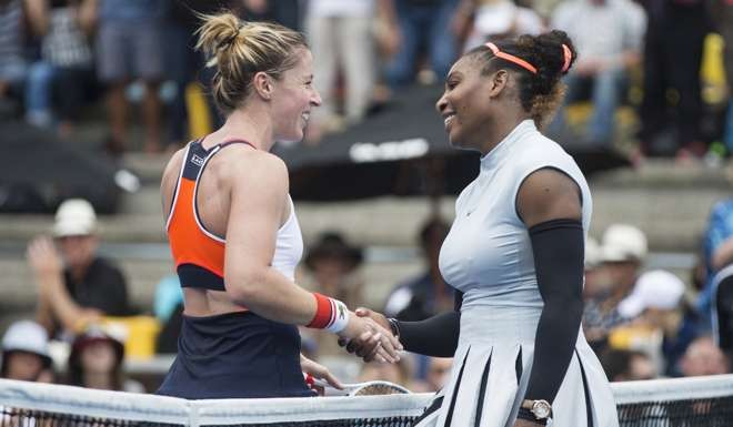 Serena Williams (right) is congratulated by Pauline Parmentier of France.
