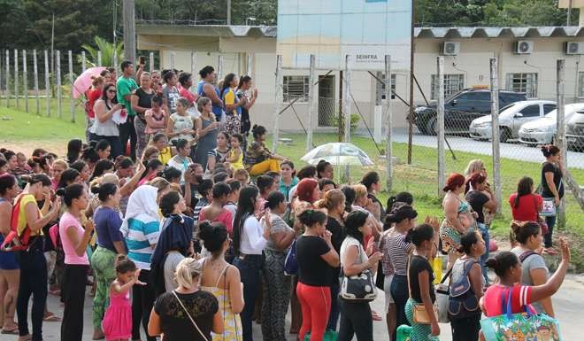 Relatives of inmates ask for information at the main gate of the Anisio Jobim Penitentiary Complex after a riot left at least 60 people killed. Photo: AFP