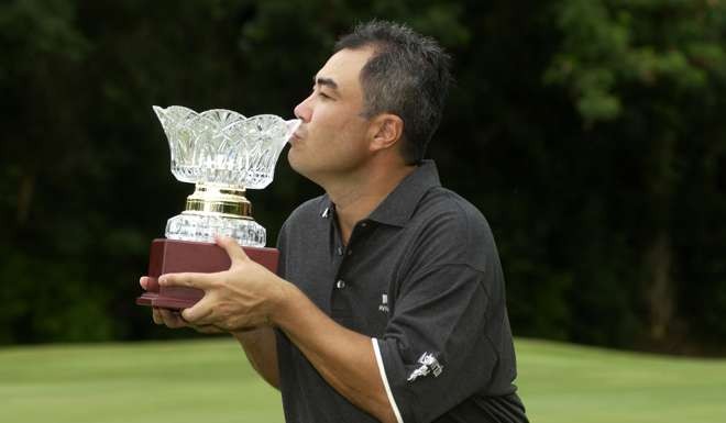 Dominique Boulet celebrates with the Hong Kong PGA Championship trophy in 2004. Photo: Richard Castka/Sportpix International