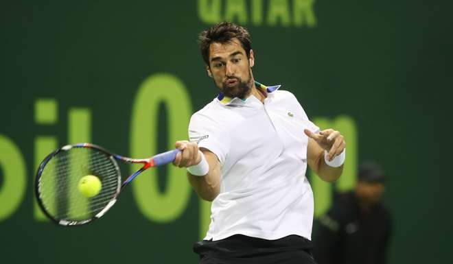 France's Jeremy Chardy retruns the ball to Andy Murray. Photo: AFP