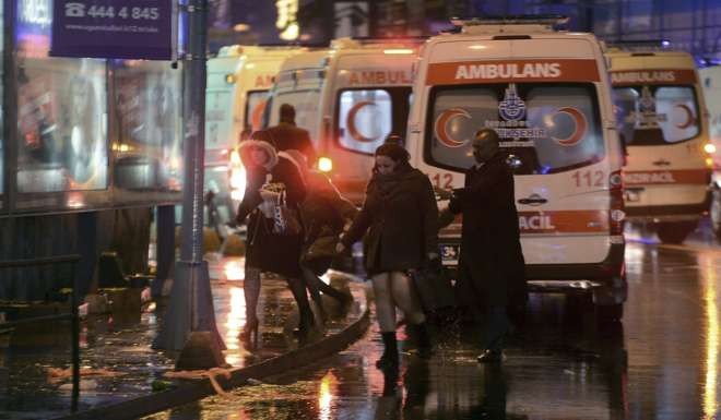Medics and security officials work at the scene after an attack at a popular nightclub in Istanbul. Photo: AP