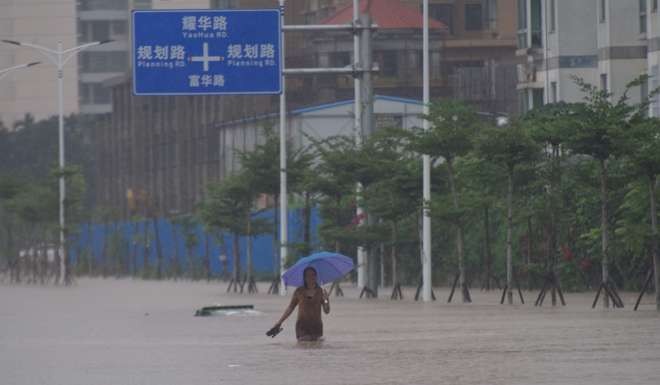 Waterlogged streets in Qionghai, Hainan caused major disruption during typhoon Sarika. Photo: Xinhua