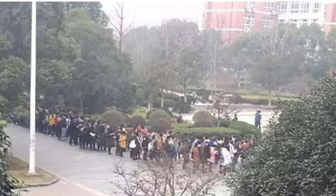 Students queue for library study places. Photo: Handout