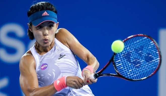 China’s Wang Qiang hits a return against Camila Giorgi of Italy. Wang lost the match to bow out of the Shenzhen Open.