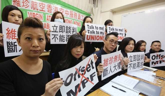 Virgin Atlantic cabin crew hit by job cuts protest against the MPF offset mechanism at a press conference in Mong Kok on December 20, 2015. Photo: Edward Wong