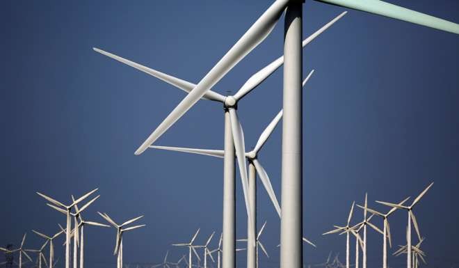 The investment in green energy sources, such as wind turbines reflects Beijing’s continued focus on curbing the use of fossil fuels. Photo: Reuters