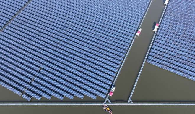 An aerial photo taken on December 24, 2016 shows a solar power project under construction in Cixi City, east China's Zhejiang province. Photo: Xinhua